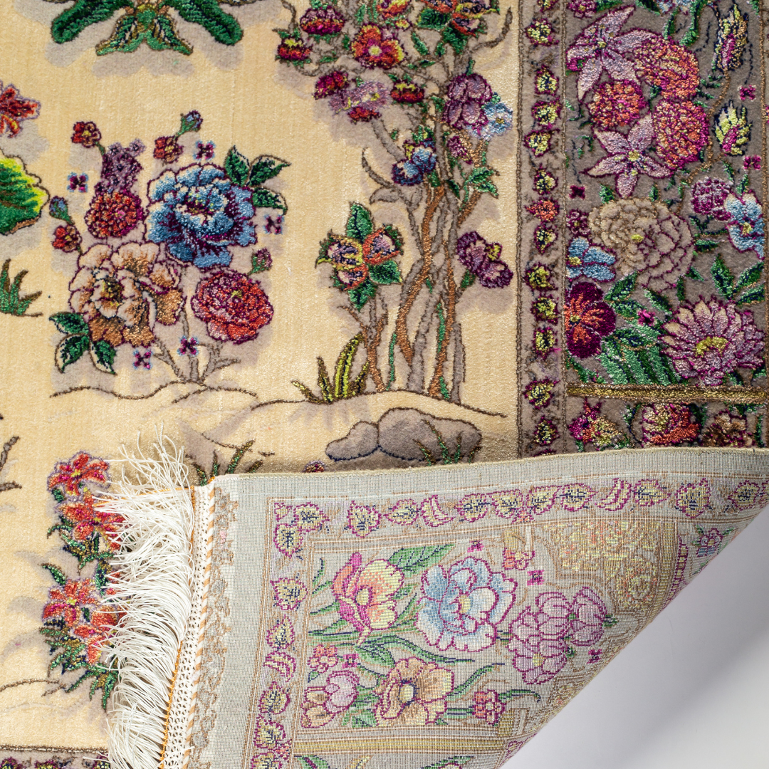 Floral silk rug in beige with multicolor detailing, handmade with intricate weaving and vibrant botanical patterns.

