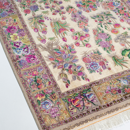 Floral silk rug in beige with multicolor detailing, handmade with intricate weaving and vibrant botanical patterns.


