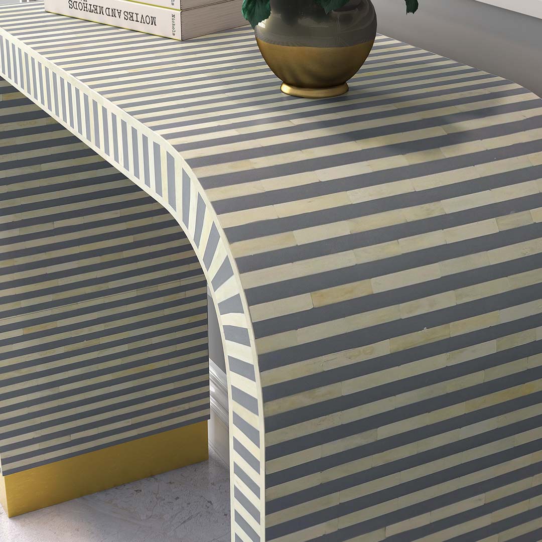 Elegant Lume Console in grey bone inlay with arched design and gold base, adding sophistication to entryways and living spaces.