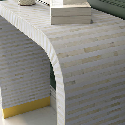 Elegant white bone inlay console with intricate detailing and a modern curved silhouette.