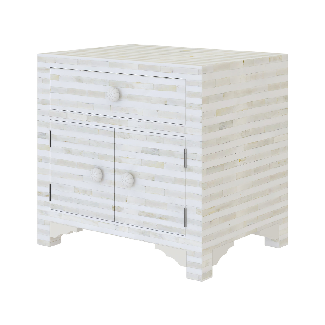 The Lume Side Drawer features white bone inlay with cabinet doors and a drawer. A graceful accent for luxury interiors.
