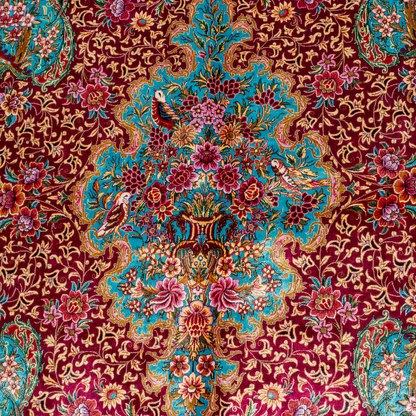 Opulent silk rug with ruby base and turquoise floral accents. Detailed handwoven artistry ideal for luxury, dramatic interior settings.

