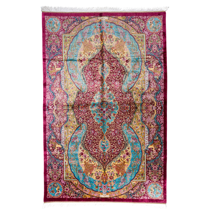 Opulent silk rug with ruby base and turquoise floral accents. Detailed handwoven artistry ideal for luxury, dramatic interior settings.

