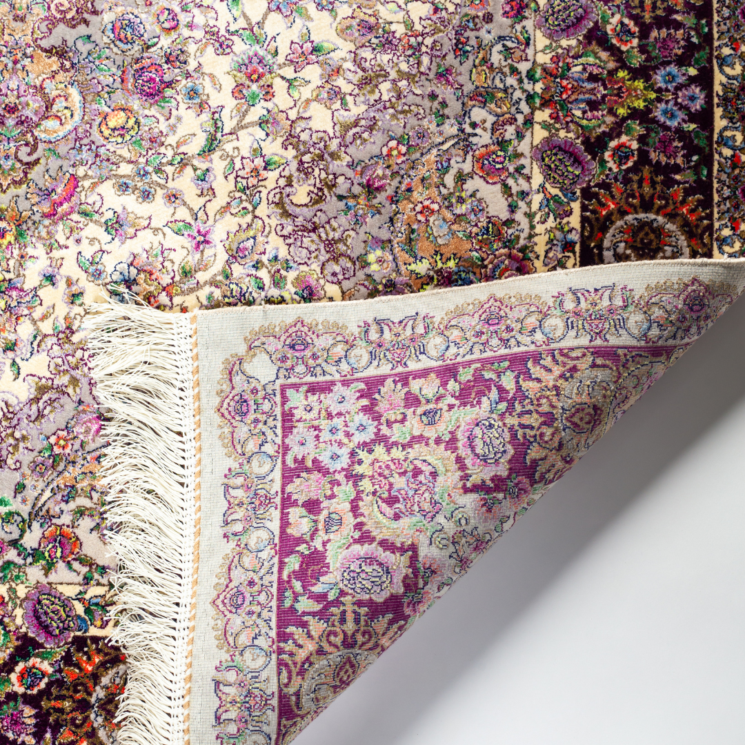 Miren silk rug in ivory and purple with intricate floral design, handwoven with fine craftsmanship and premium detailing.
