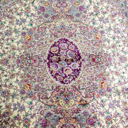 Miren silk rug in ivory and purple with intricate floral design, handwoven with fine craftsmanship and premium detailing.
