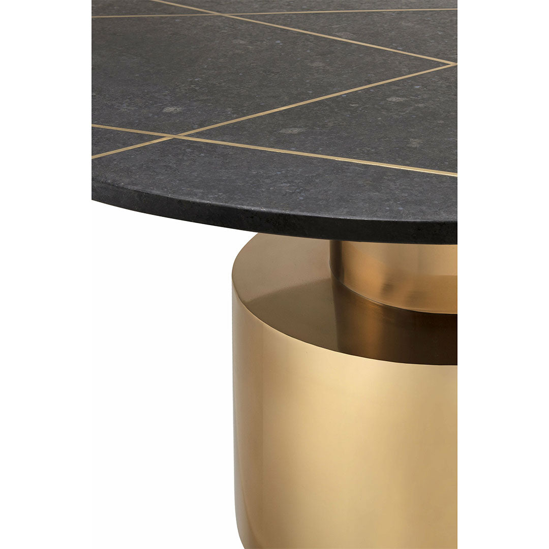 Round black marble coffee table with subtle gold inlay accents and a bold cylindrical gold-finished metallic base.