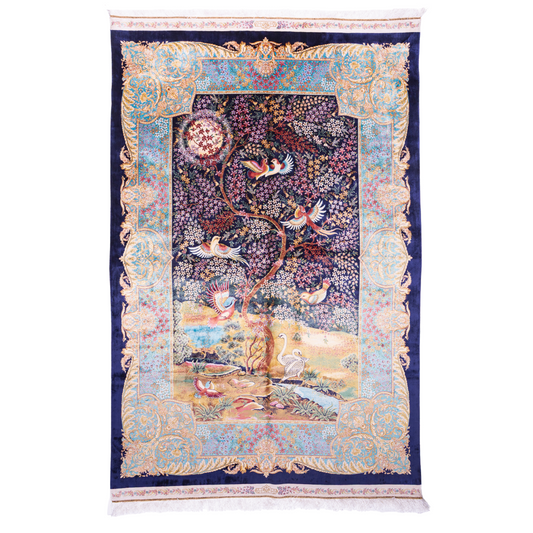Elegant silk rug with flying birds and floral tree scene, bordered in ornate gold and blue. Handwoven with incredible detail and texture.

