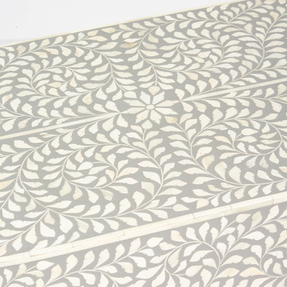 Elegant grey bone inlay coffee table with a gold base. Compact, handcrafted and eye-catching – a timeless addition to your space.