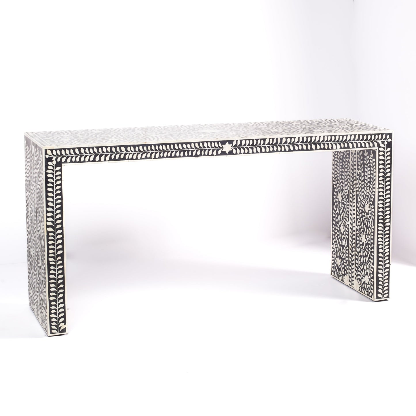 Black bone inlay console table with floral and vine motifs, handcrafted by artisans and finished with intricate detailing across the surface.
