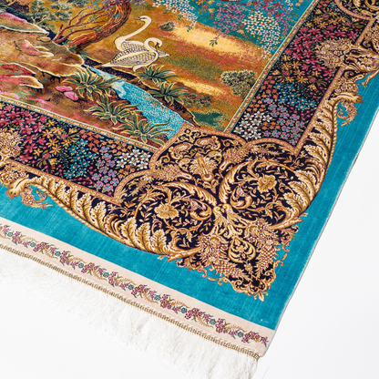 Luxurious silk rug with turquoise base, floral borders, and tree of life with colorful birds and swans.

