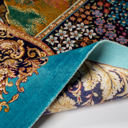 Luxurious silk rug with turquoise base, floral borders, and tree of life with colorful birds and swans.

