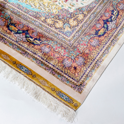 Luxurious silk rug with warriers and horses detailing and ornate floral border in rich tones. Intricate details handwoven for timeless appeal.