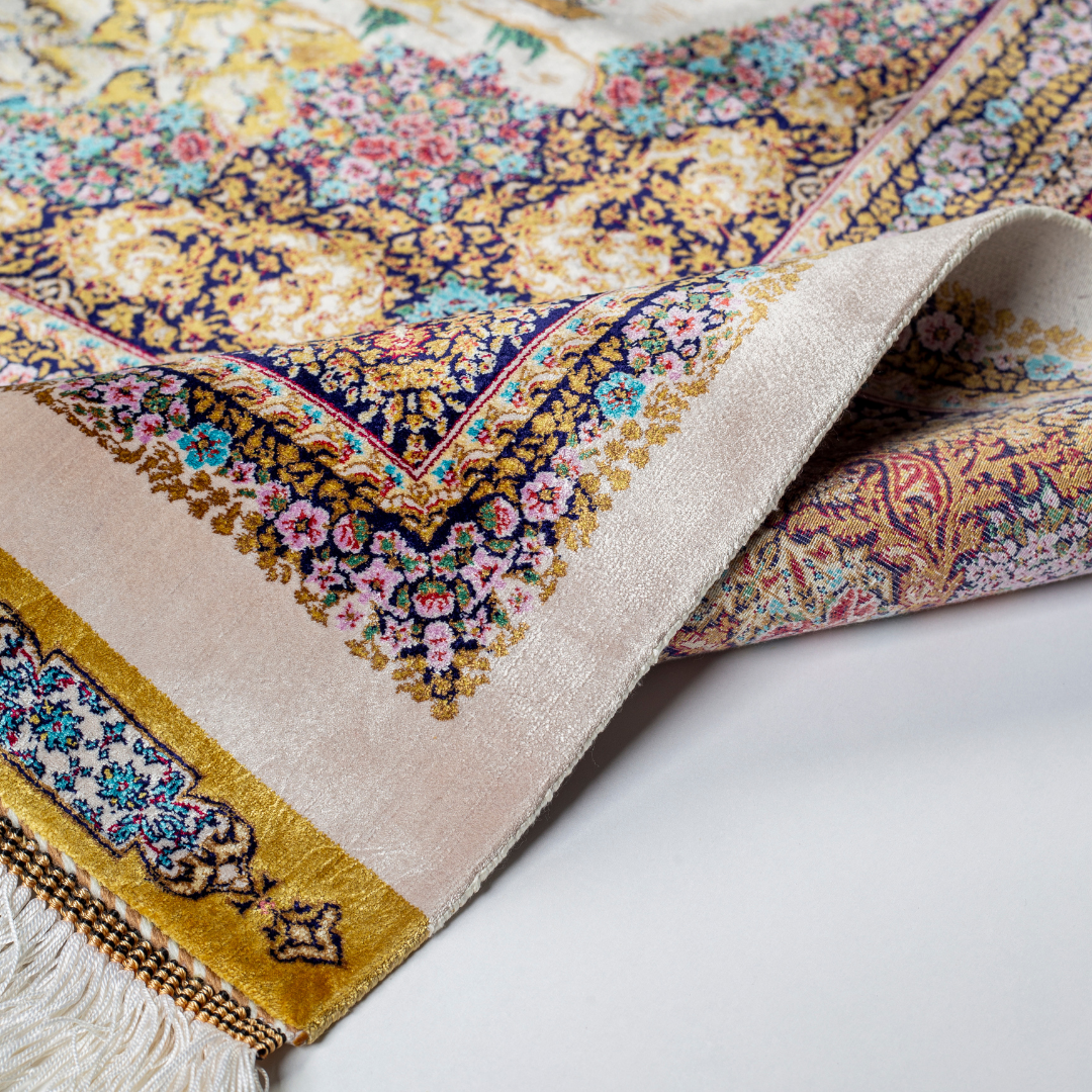 Luxurious silk rug with warriers and horses detailing and ornate floral border in rich tones. Intricate details handwoven for timeless appeal.