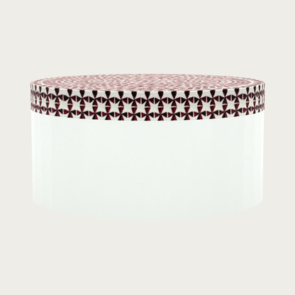 Round red bone inlay coffee table featuring a vibrant mosaic pattern on the top and sides. Perfect for modern and eclectic interiors.