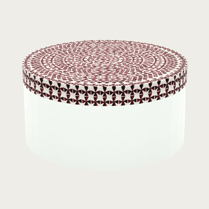 Round red bone inlay coffee table featuring a vibrant mosaic pattern on the top and sides. Perfect for modern and eclectic interiors.