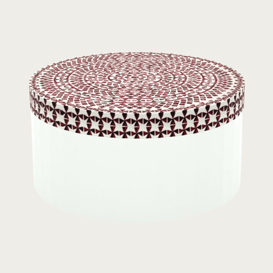 Round red bone inlay coffee table featuring a vibrant mosaic pattern on the top and sides. Perfect for modern and eclectic interiors.
