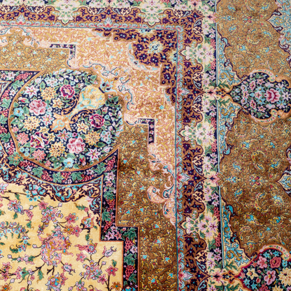 Luxurious silk rug featuring floral medallion pattern in gold, ivory, rose, and turquoise tones with intricate craftsmanship.