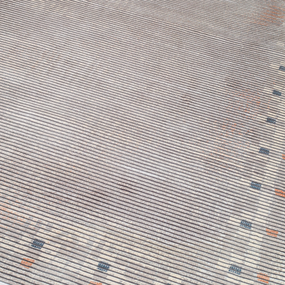 Grey striped Cotton rug with fine orange and blue motif border, in 400x300 cms size, perfect for modern interiors.