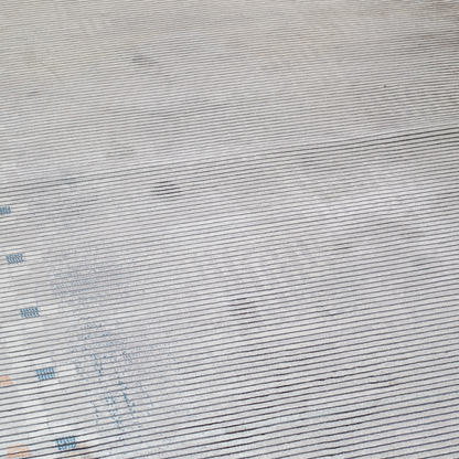 Grey striped Cotton rug with fine orange and blue motif border, in 400x300 cms size, perfect for modern interiors.