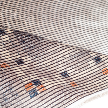 Grey striped Cotton rug with fine orange and blue motif border, in 400x300 cms size, perfect for modern interiors.