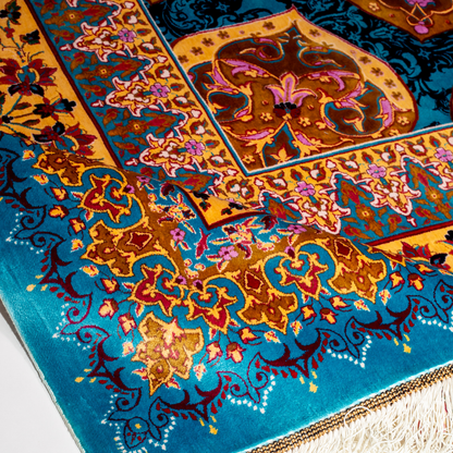 Spot silk rug in 350x250 cms featuring turquoise and mustard floral designs with a detailed medallion and golden border work.
