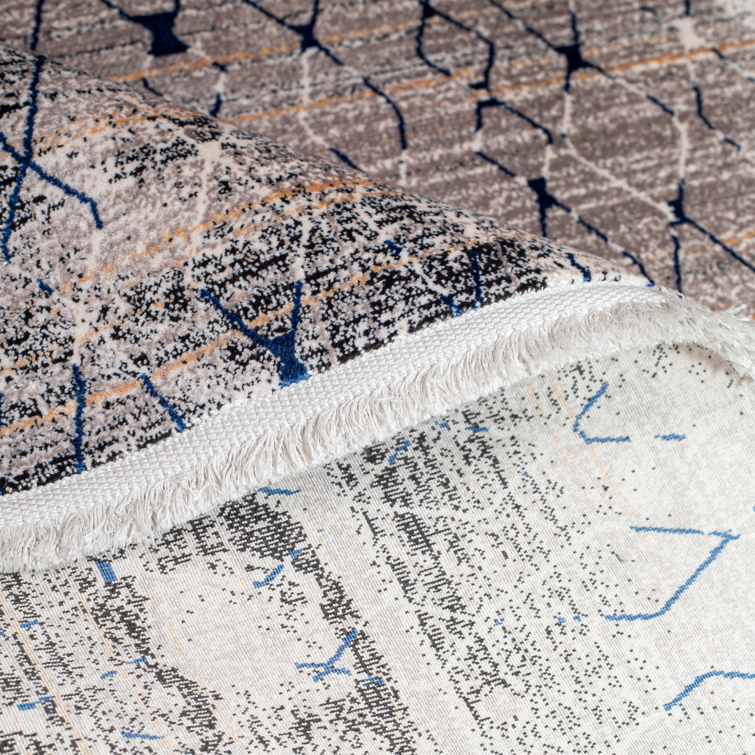 Stark cotton Rug in 200x300 cms with a distressed ivory base, taupe texture, and navy geometric lattice design, perfect for contemporary living spaces.