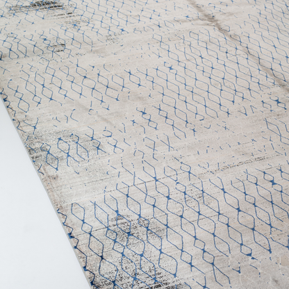 Stark cotton Rug in 200x300 cms with a distressed ivory base, taupe texture, and navy geometric lattice design, perfect for contemporary living spaces.
