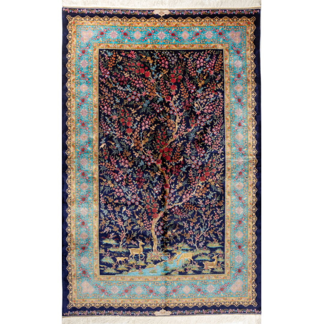 Silk rug in navy with crimson, pink, jade, and gold floral design. Tree-of-life motif. Size: 225x150 cm. Ships worldwide.