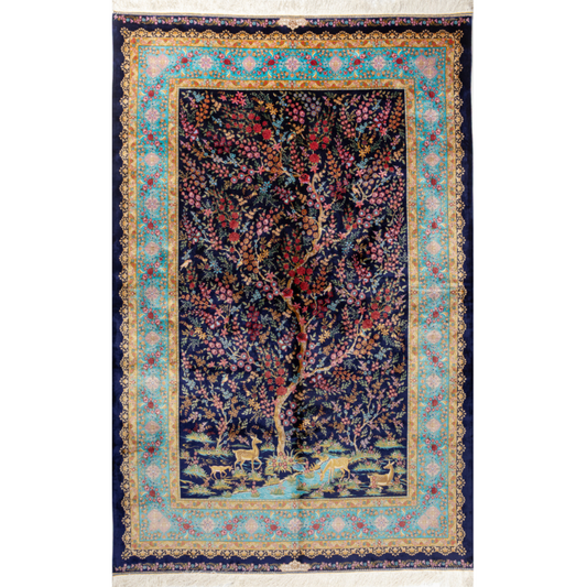 Silk rug in navy with crimson, pink, jade, and gold floral design. Tree-of-life motif. Size: 225x150 cm. Ships worldwide.