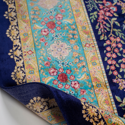 Silk rug in navy with crimson, pink, jade, and gold floral design. Tree-of-life motif. Size: 225x150 cm. Ships worldwide.