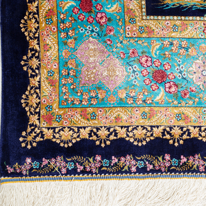 Silk rug in navy with crimson, pink, jade, and gold floral design. Tree-of-life motif. Size: 225x150 cm. Ships worldwide.