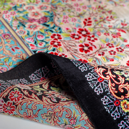 Tapin Silk Rug featuring nature-inspired artwork with birds, flowers, and flowing water on an ivory base with turquoise and black borders, 150x100 cm.