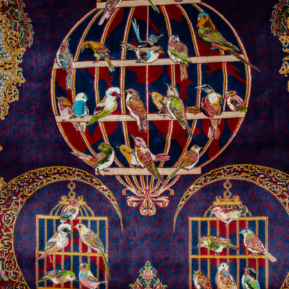 Terra silk rug with navy base, multi-colour birdcage motifs, floral accents, and detailed animal and garden scenes in 150x100 cm size.
