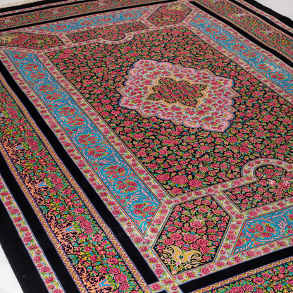 200x300 cm black silk rug with vivid pink rose motifs, turquoise borders, and central medallion. Intricate hand-knotted floral design.