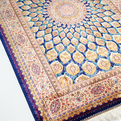 Tobe silk rug featuring a medallion and floral design in navy, ruby, teal, and ivory. Size: 150x100 cms.
