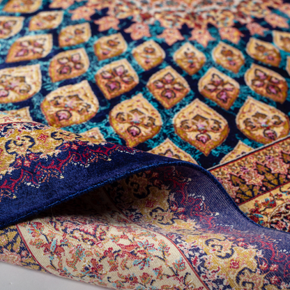 Tobe silk rug featuring a medallion and floral design in navy, ruby, teal, and ivory. Size: 150x100 cms.