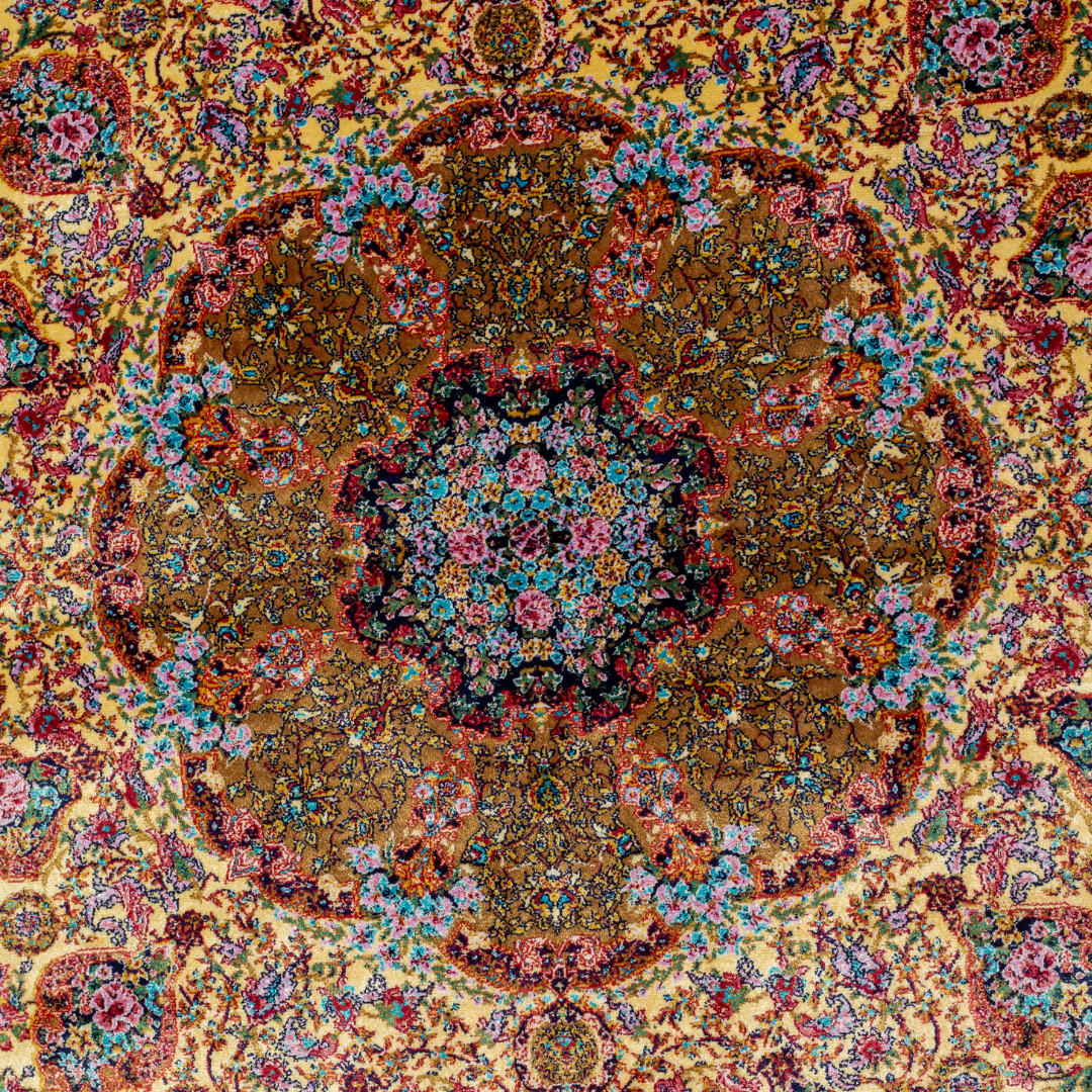 Golden silk rug with floral medallion center and wine-toned border, featuring intricate handmade detailing and vibrant color accents.
