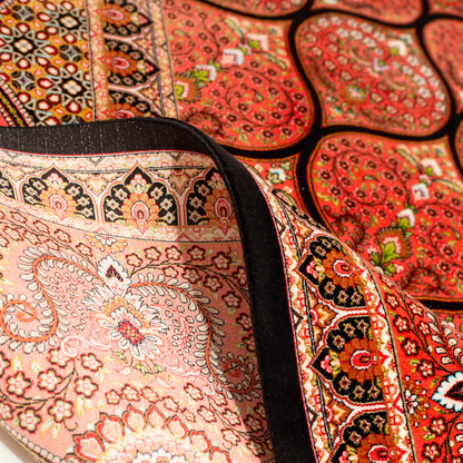 Detailed view of the Val silk rug in 200x300 cms featuring a red medallion pattern with floral motifs and intricate border work.