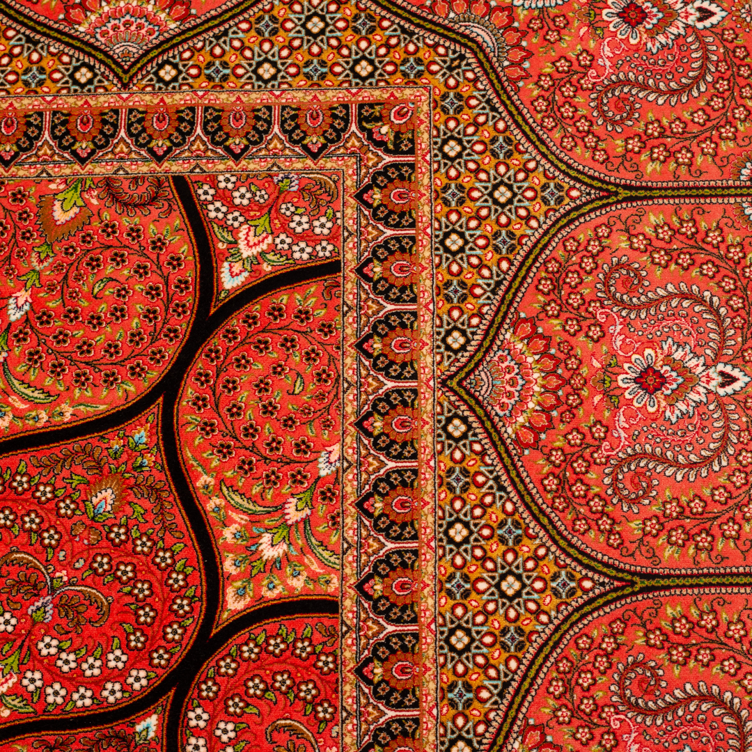 Detailed view of the Val silk rug in 200x300 cms featuring a red medallion pattern with floral motifs and intricate border work.