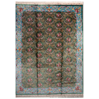 Green silk rug with detailed rose motifs and a turquoise border, featuring Persian-inspired floral designs and ornamental flourishes.