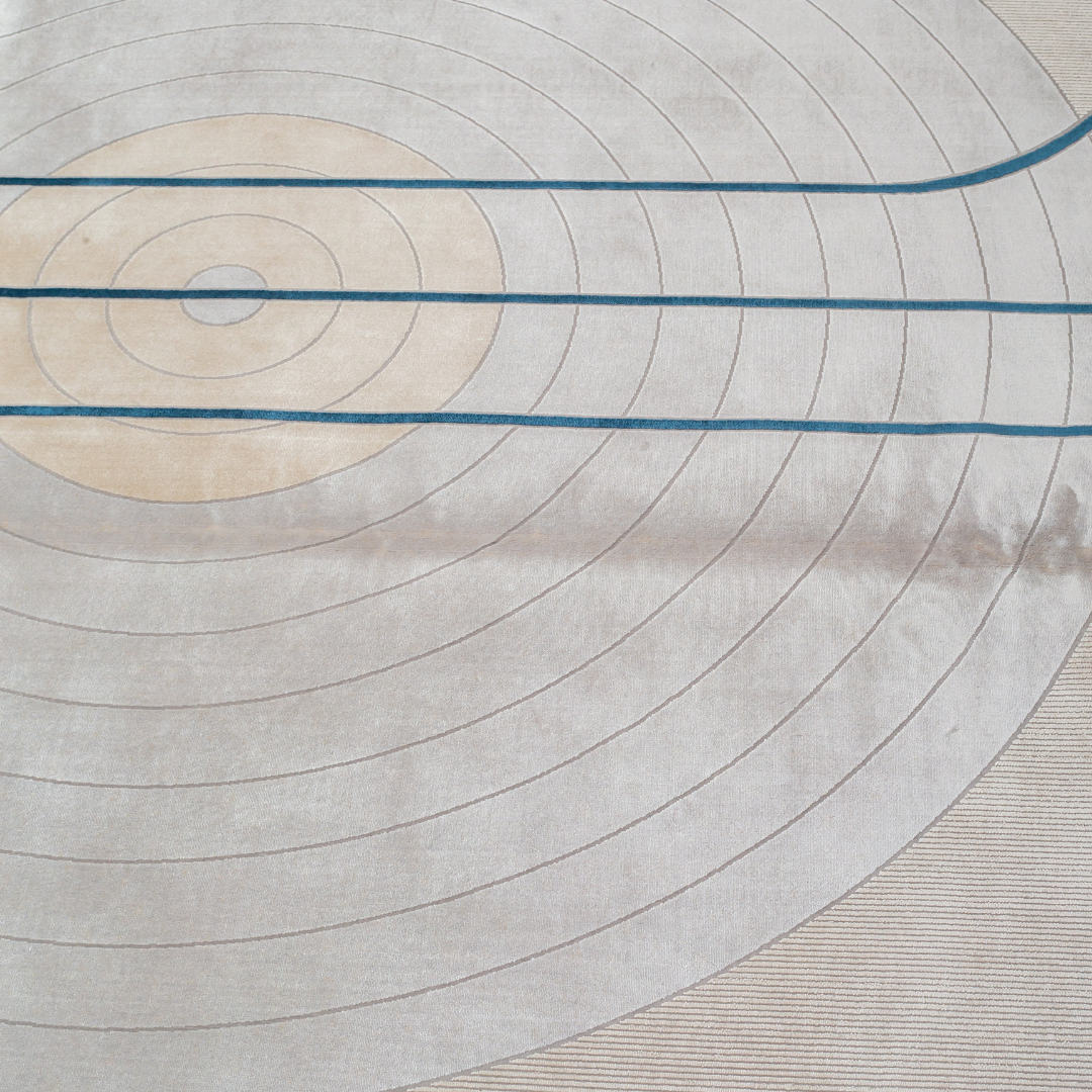Victor cotton Rug in 200x300 cm featuring beige and ivory tones with minimal blue line and circle design, made from soft silk blend.