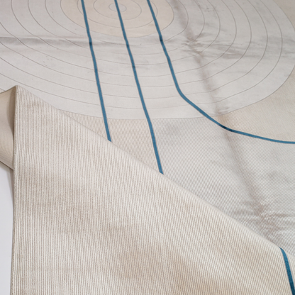 Victor cotton Rug in 200x300 cm featuring beige and ivory tones with minimal blue line and circle design, made from soft silk blend.