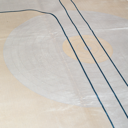 Victor cotton Rug in 200x300 cm featuring beige and ivory tones with minimal blue line and circle design, made from soft silk blend.
