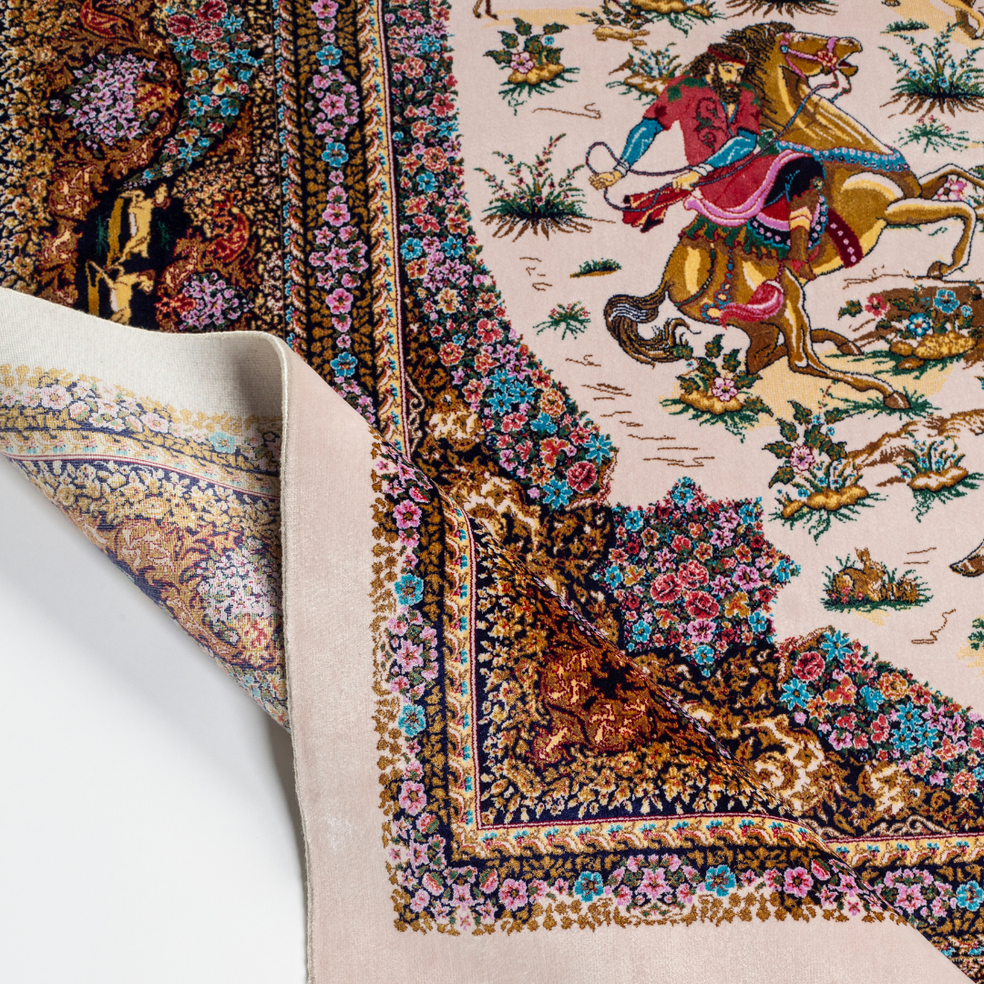 Silk rug with an ivory base, colorful warriors scene, and a detailed border in plum, gold, teal, and indigo floral patterns.