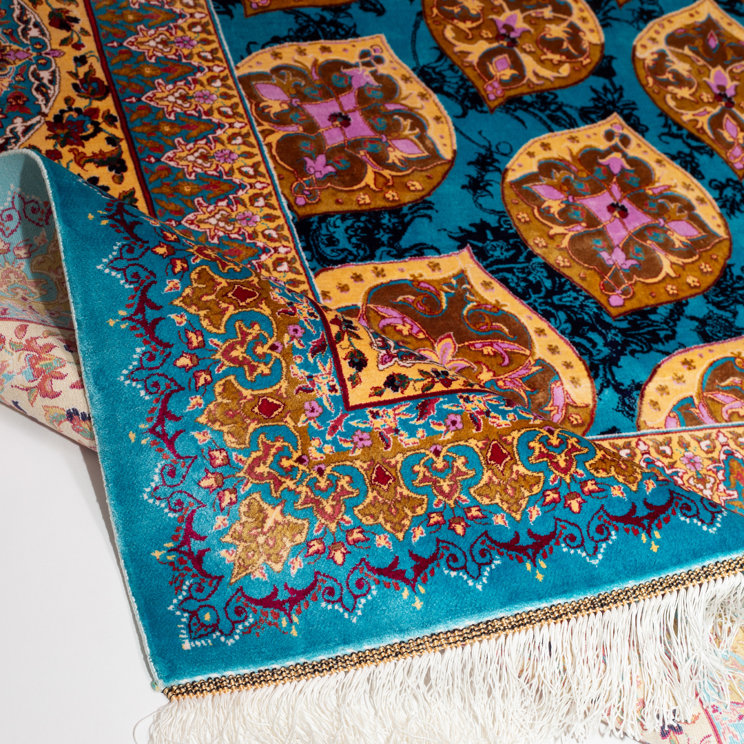 Luxurious 200x300 cm silk rug featuring a radiant blue and gold medallion design with intricate floral and geometric detailing.
