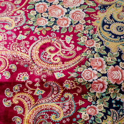 Zane Silk Rug with crimson red base, floral medallion pattern, intricate gold scrolls, and a navy border, crafted in fine silk with detailed motifs.