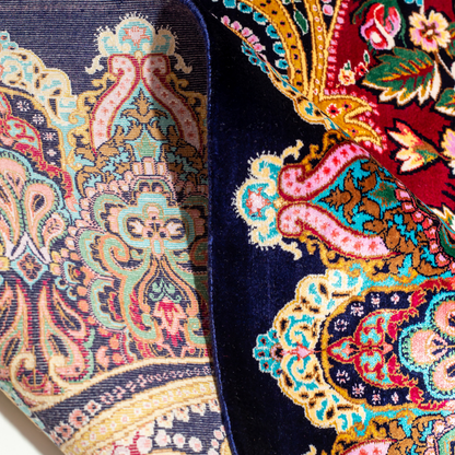 Zane Silk Rug with crimson red base, floral medallion pattern, intricate gold scrolls, and a navy border, crafted in fine silk with detailed motifs.