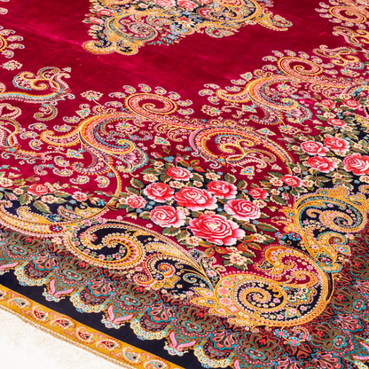 Zane Silk Rug with crimson red base, floral medallion pattern, intricate gold scrolls, and a navy border, crafted in fine silk with detailed motifs.