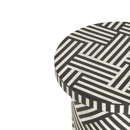 Black bone inlay side table with bold striped pattern, handcrafted with a brass base accent, ideal for modern interiors.