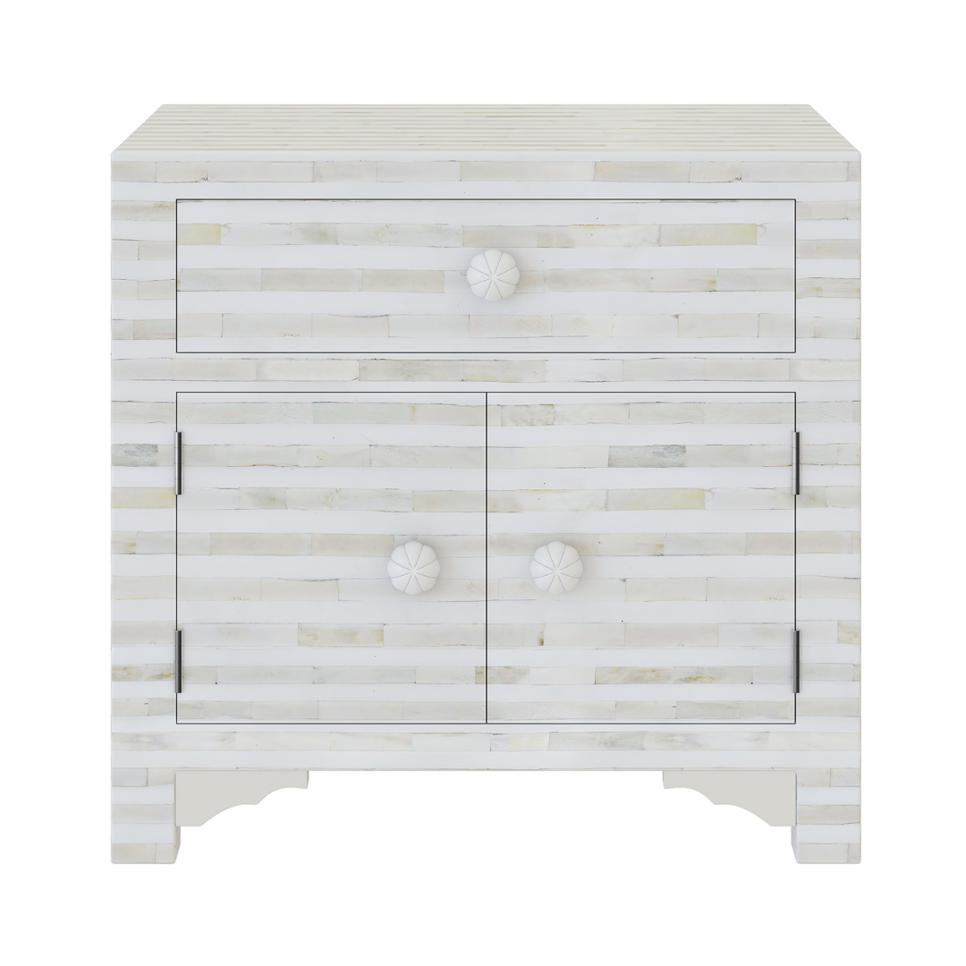 The lume Side Drawer features white bone inlay with cabinet doors and a drawer. A graceful accent for luxury interiors.
